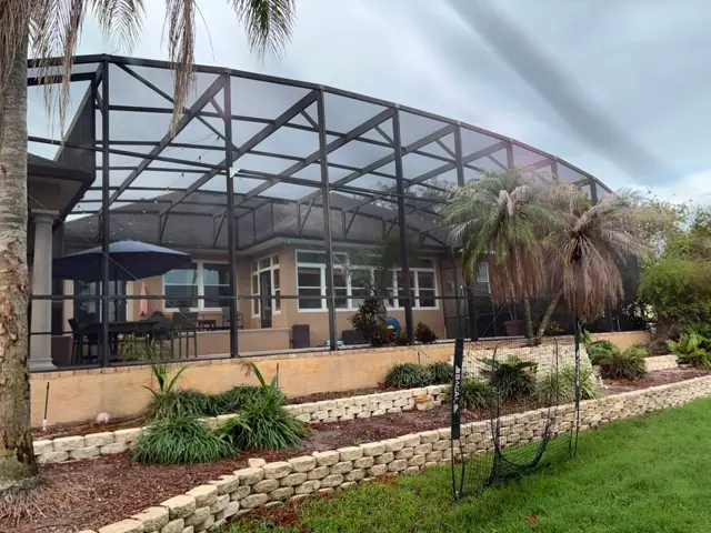 Large completed residential pool cage and screen enclosure in Lakeland, Florida